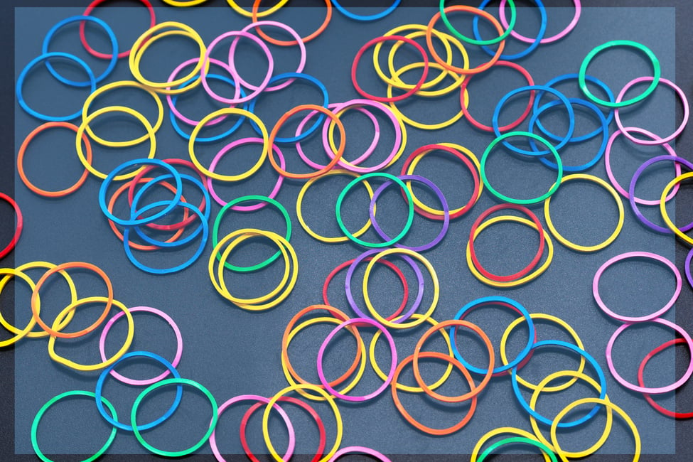 Diversity concept. mix colorful rubber band on black background